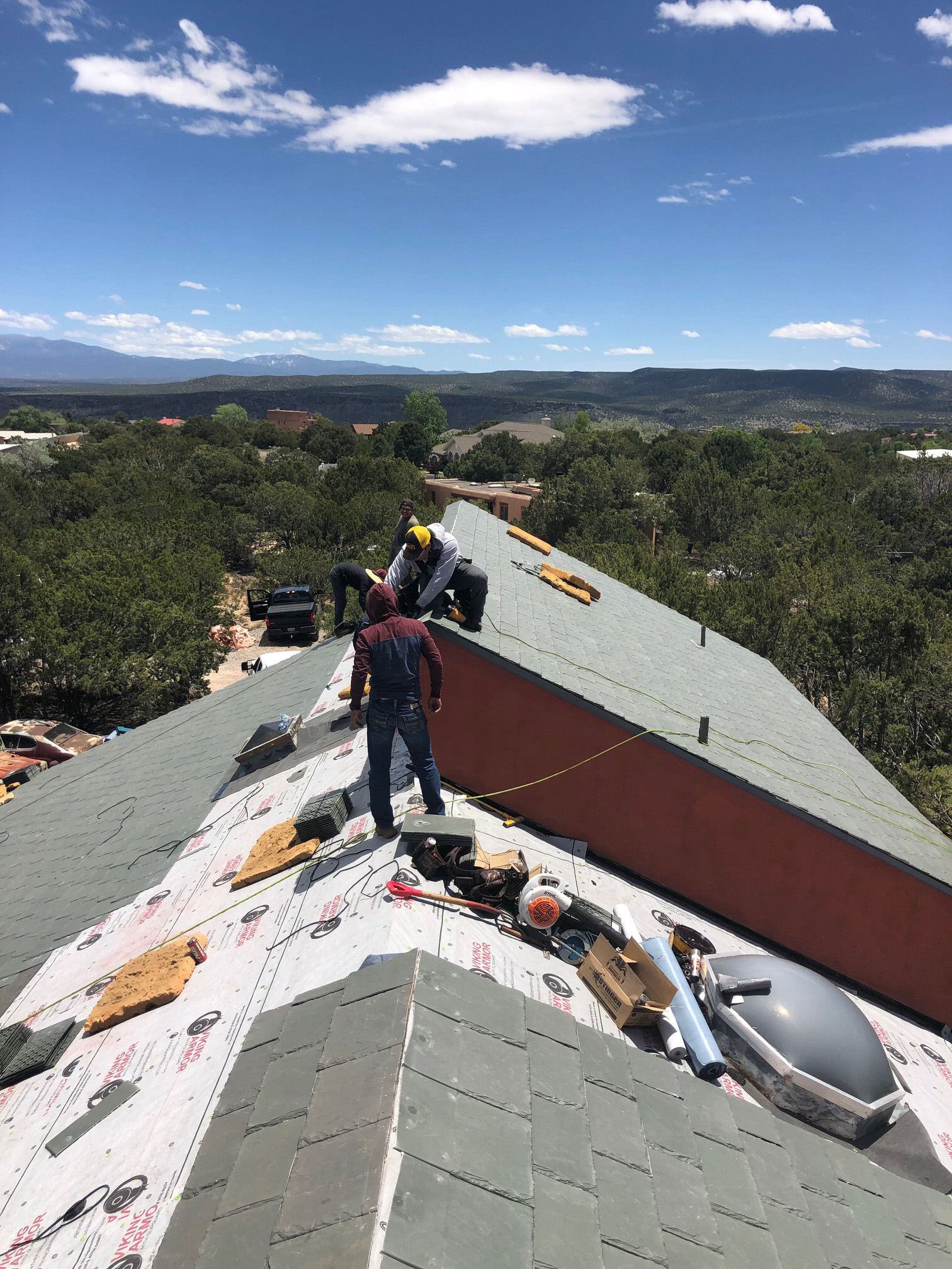 Roof material placement in process